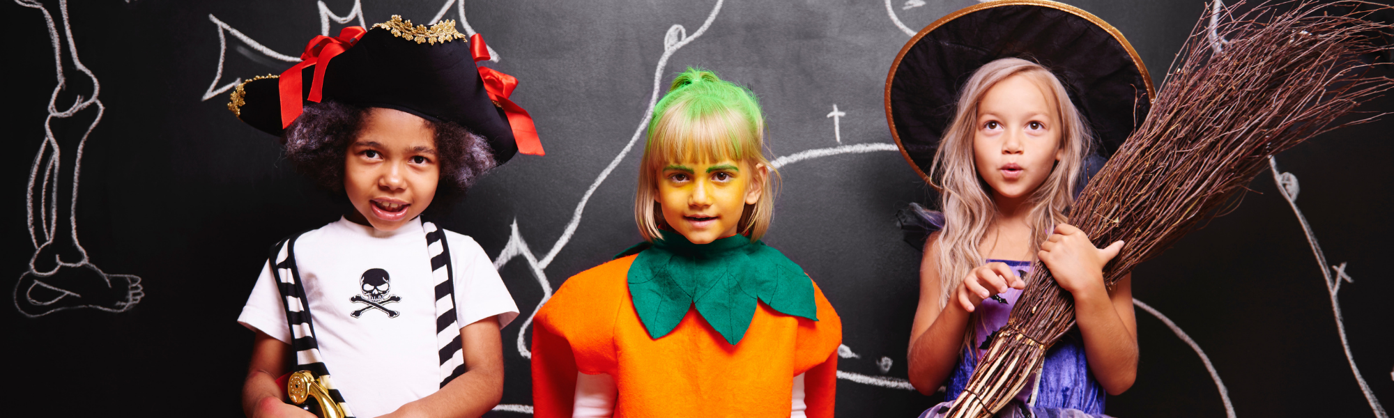 three kids in Halloween costumes 